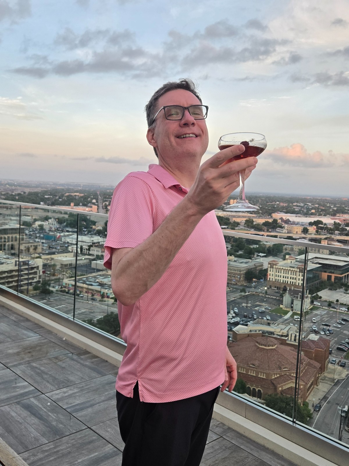 Me enjoying a drink on a rooftop terrace